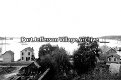 view of Port Jefferson harbor and East Broadway; "Harbor of Port Jefferson"
